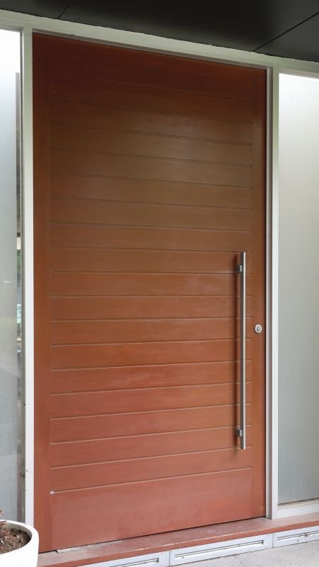 Wooden door with a handle on a building exterior
