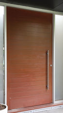 Wooden door with a handle on a building exterior