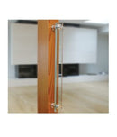Glass door with wooden frame and metal handle in a blurred indoor setting