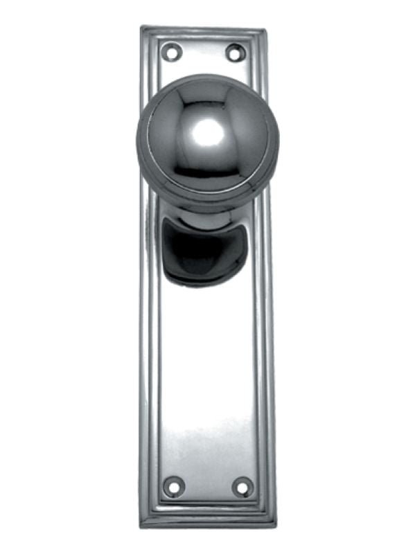 Polished metal door handle on a white background