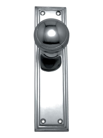Polished metal door handle on a white background