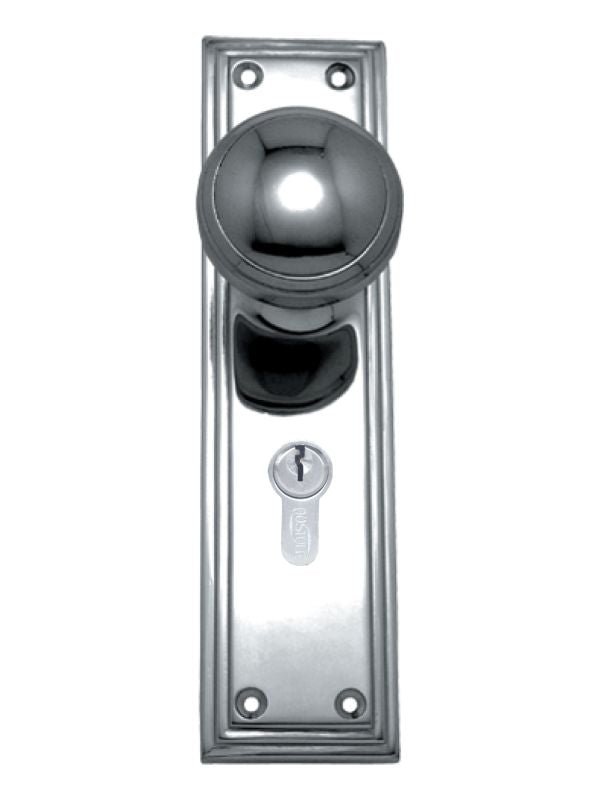 Chrome door handle with keyhole on a white background