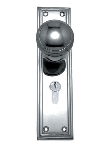 Chrome door handle with keyhole on a white background