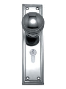 Chrome door handle with keyhole on a white background