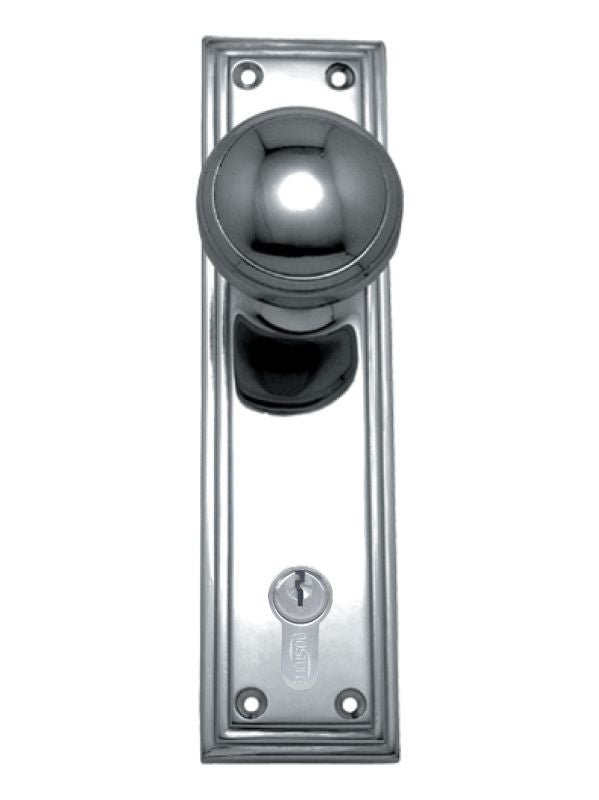 Chrome door handle with keyhole on a white background