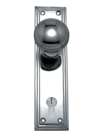 Chrome door handle with keyhole on a white background