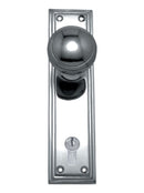Chrome door handle with keyhole on a white background