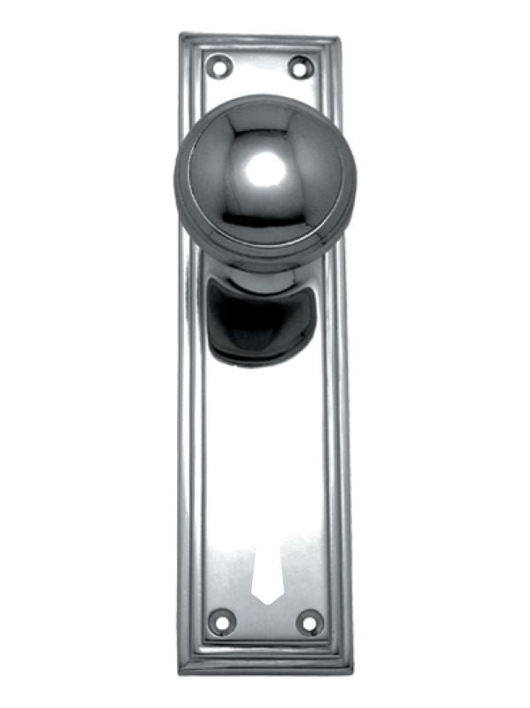 Polished chrome door handle on a white background
