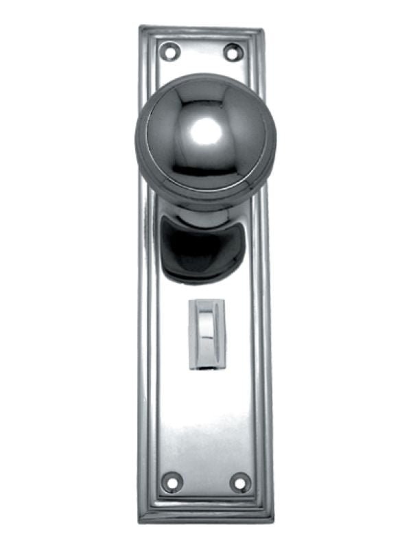 Chrome door handle and plate on a white background