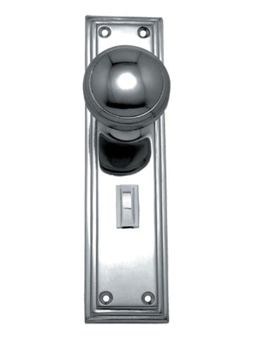 Chrome door handle and plate on a white background