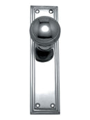 Polished metal door handle on a white background