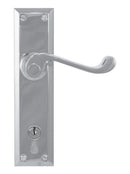 Metal door handle with lock on a white background