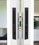 Modern sliding glass door with black handles and a white frame.