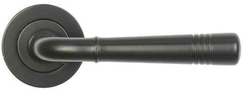 Black door handle on a white background