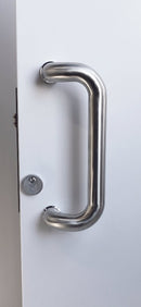 Metal door handle on a white door