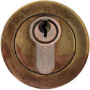 Bronze cylindrical lock on a white background