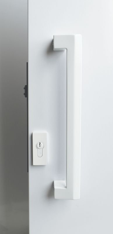 Modern door handle and lock on a white door