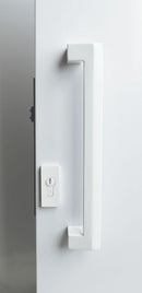 Modern door handle and lock on a white door