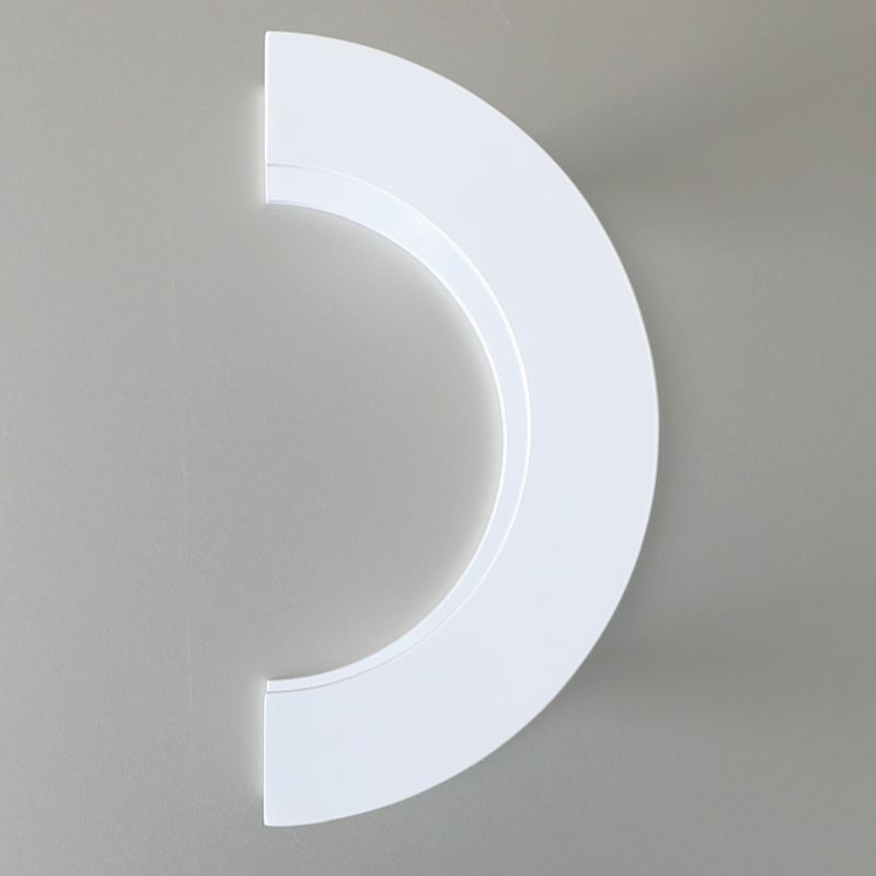 White semi-circular light fixture on a gray background
