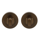 Two bronze door handles on a white background