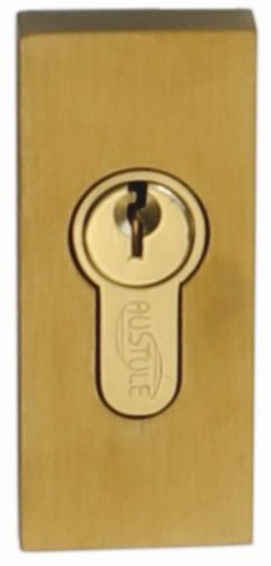 Brass door lock with keyhole on a white background