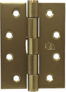 Brass door hinge with visible brand logo on a gold background