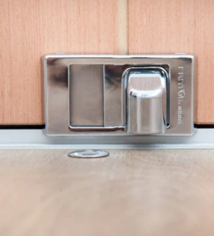 Metallic door handle on a wooden door
