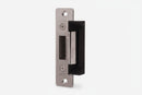Metal door handle with black finish on a white background