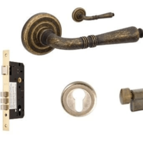 Balmain Rose entrance set with door handle, lock, and escutcheon on a white background