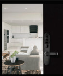 Modern interior with a kitchen and living room, featuring a smart door handle.