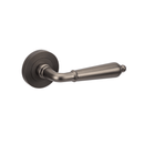 A single graphite nickel door handle with a rose fixing, in a sleek and modern style.