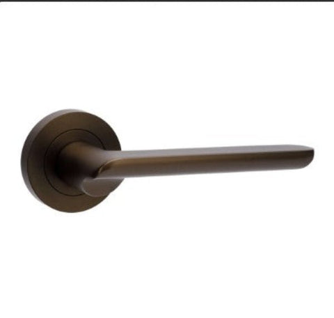 Bronze door handle on a white background