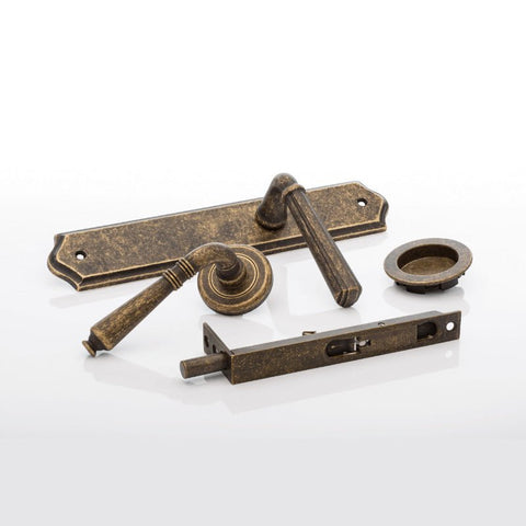 Set of vintage-style door handles and lock mechanism on a white background