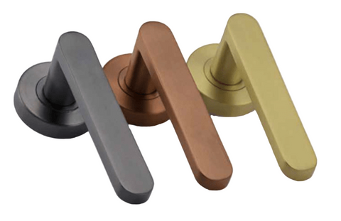 Four door handles in black, bronze, and gold on a white background