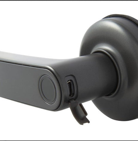 Close-up of a modern door handle with USB port on a white background