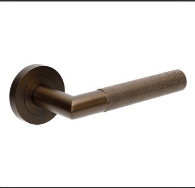 Bronze door handle on a white background