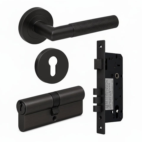 Bronze door handle set with lock mechanism on a white background