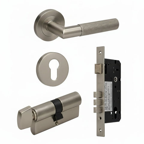 Bronze door handle set with lock components on a white background