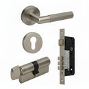 Bronze door handle set with lock components on a white background