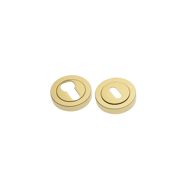 Two gold door locks on a white background