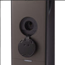 Close-up of a black door handle on a dark surface