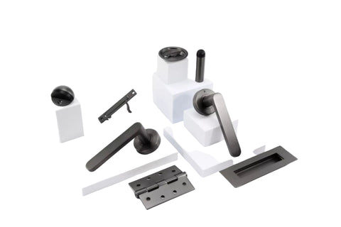 Set of black and silver door handles and hinges on a white background