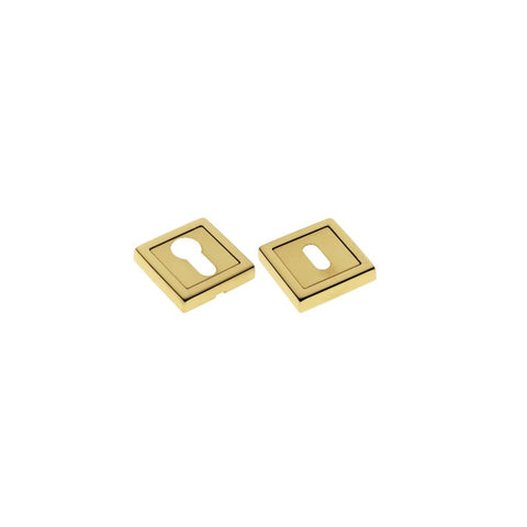 Two gold square earrings on a white background