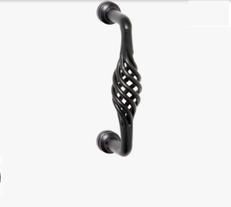 Decorative black cabinet handle on a white background