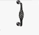 Decorative black cabinet handle on a white background