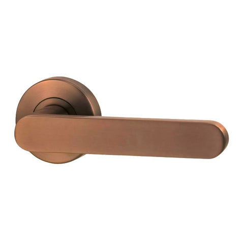 Bronze door handle on a white background