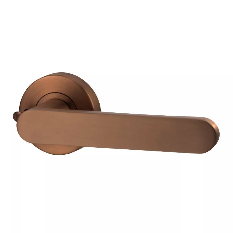 Bronze door handle on a white background