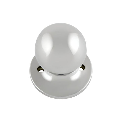 Polished chrome door knob on a white background