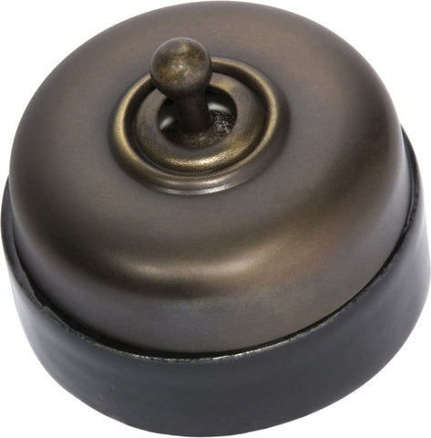 TRADCO BLACK PORCELAIN BASE SWITCH POLISHED BRASS