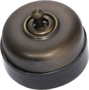 TRADCO BLACK PORCELAIN BASE SWITCH POLISHED BRASS
